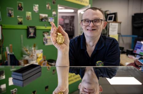 Team member selling at the till