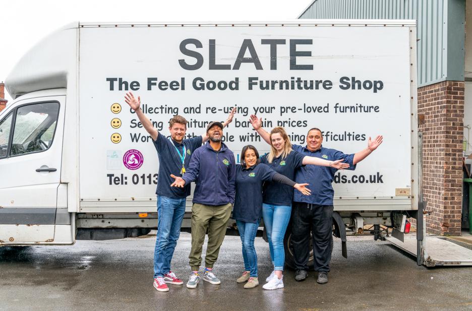 Volunteers and staff in front of the van