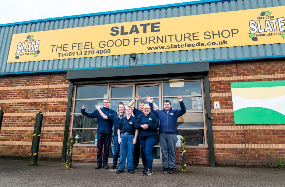 Team members outside the shop front